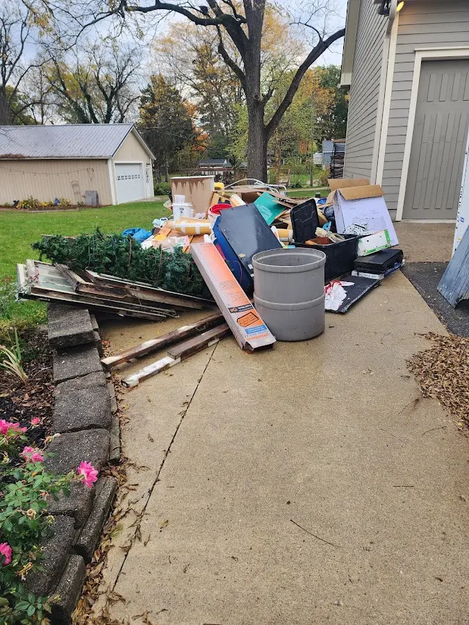 Dumpster being loaded with debris for Roofing Dumpster Rental in Lakeland Highlands